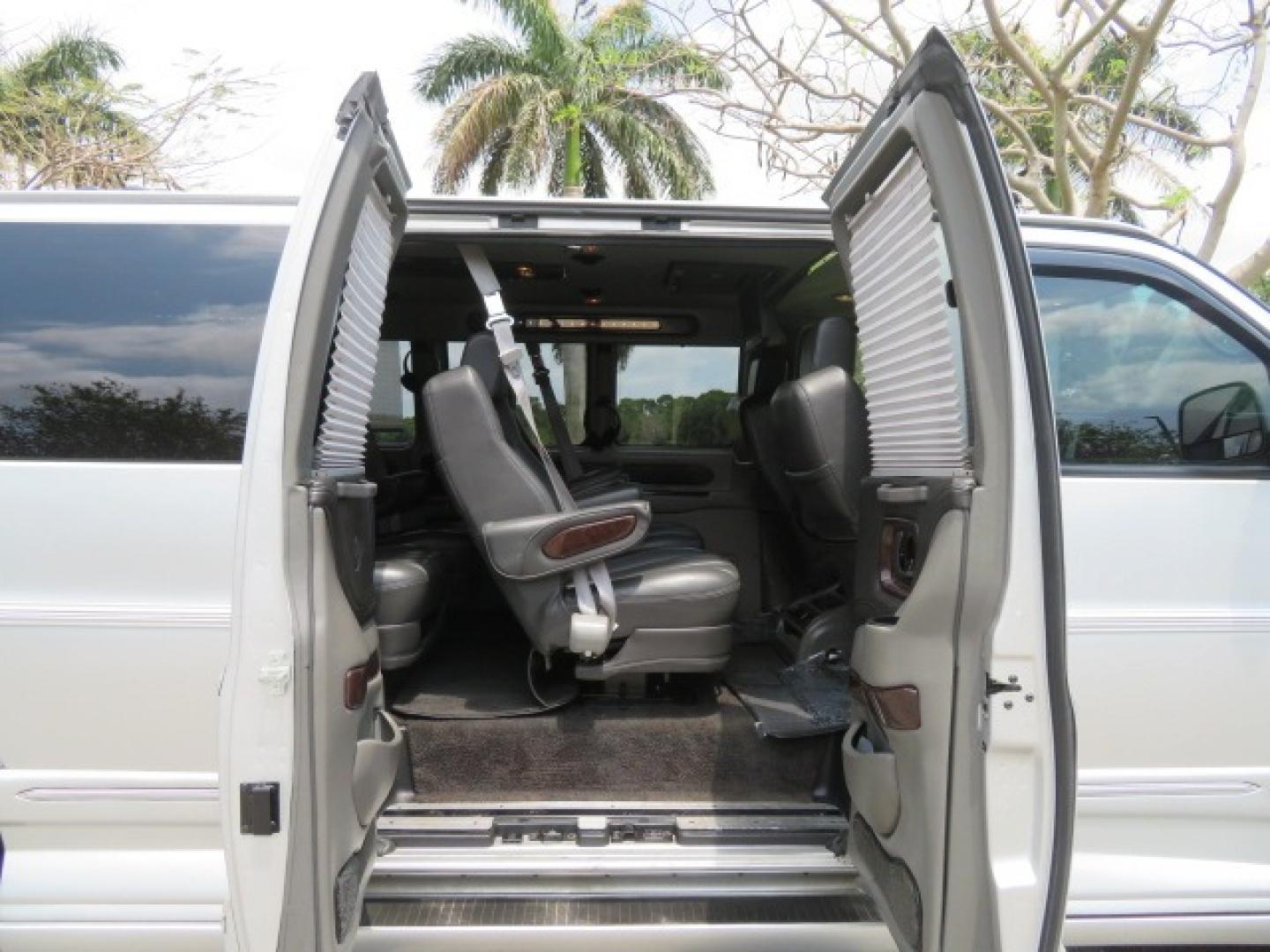 2014 Chevrolet Express (1GBWGLCG3E1) , located at 4301 Oak Circle #19, Boca Raton, FL, 33431, (954) 561-2499, 26.388861, -80.084038 - You are looking at a Rare 2014 Chevy Express 2500 Quigley 4x4 Four Wheel Drive Explorer Limited SE 9 Passenger Conversion Van with: 107K Original Miles, 6 Captain Chairs, Rear Power Folding Bench Seat Bed, Center Consoler Cooler, Front PPF (Paint Protection Film) Explorer Limited Conversion Througho - Photo#45